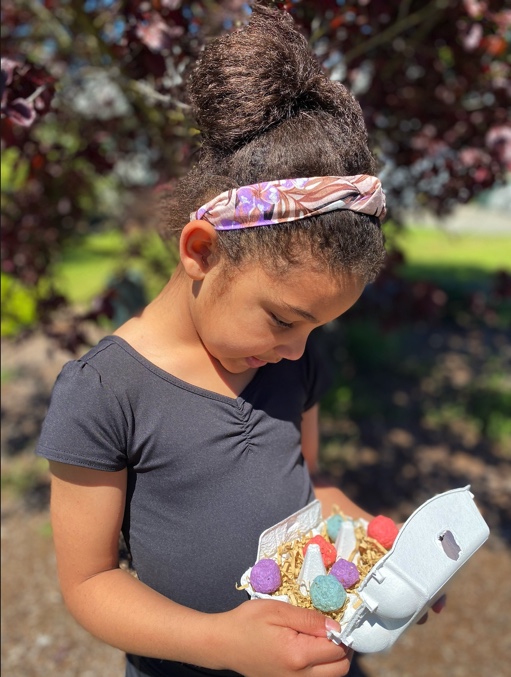 Child youth enjoying seed bomb kit gift